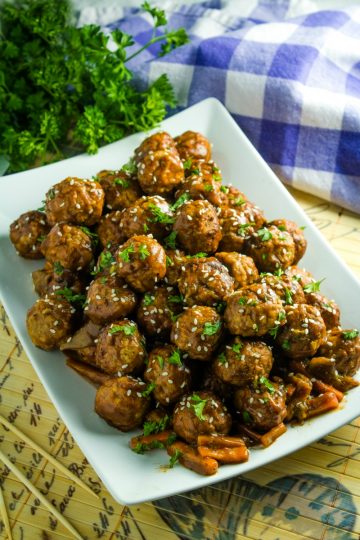 Slow Cooker Asian Barbecue Meatballs with frozen meatballs, vegetables, teriyaki sauce, barbecue sauce and srirachi are just what you need to make these sweet and spicy meatballs.