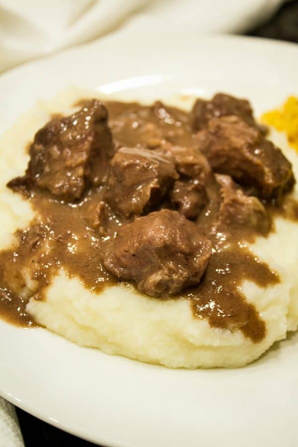 Freezer Meal Beef and Gravy - economical cubed chuck roast made with tasty onion and mushroom gravy. It's a perfect no-fuss meal. 