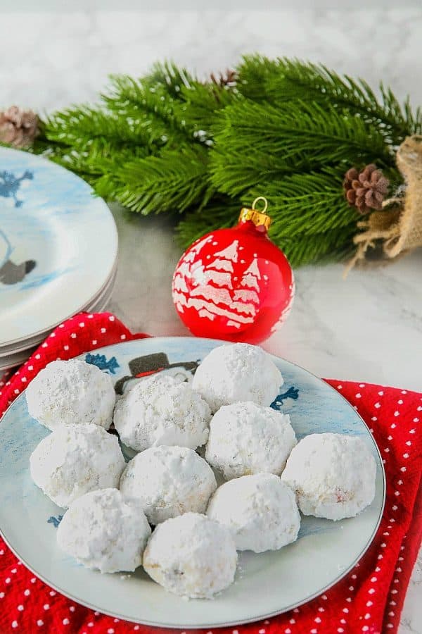 Chocolate Chip Snowball Cookies - filled with melting chocolate chips and festive sprinkles, these sugar dusted cookies are a favorite holiday cookie recipe.