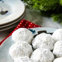 Chocolate Chip Snowball Cookies - filled with melting chocolate chips and festive sprinkles, these sugar dusted cookies are a favorite holiday cookie recipe.