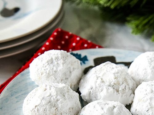 Chocolate Chip Snowball Cookies - filled with melting chocolate chips and festive sprinkles, these sugar dusted cookies are a favorite holiday cookie recipe.