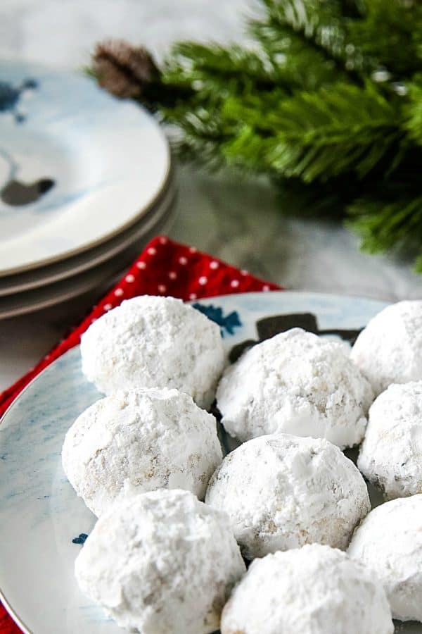 Chocolate Chip Snowball Cookies - filled with melting chocolate chips and festive sprinkles, these sugar dusted cookies are a favorite holiday cookie recipe.