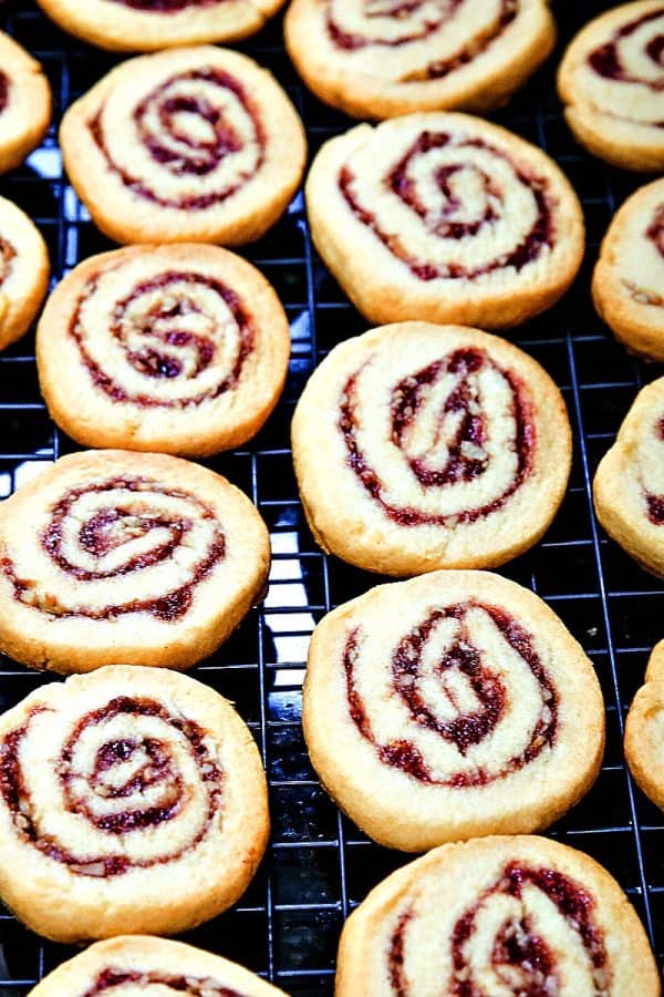 Raspberry Pecan Swirl Cookies are easy recipe sugar cookies swirled with raspberry jam and pecans. Perfect for holidays and  gift giving!