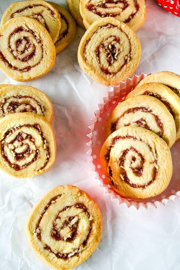 Raspberry Pecan Swirl Cookies are easy recipe sugar cookies swirled with raspberry jam and pecans. Perfect for holidays and  gift giving!