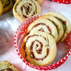 Raspberry Pecan Swirl Cookies are easy recipe sugar cookies swirled with raspberry jam and pecans. Perfect for holidays and gift giving!