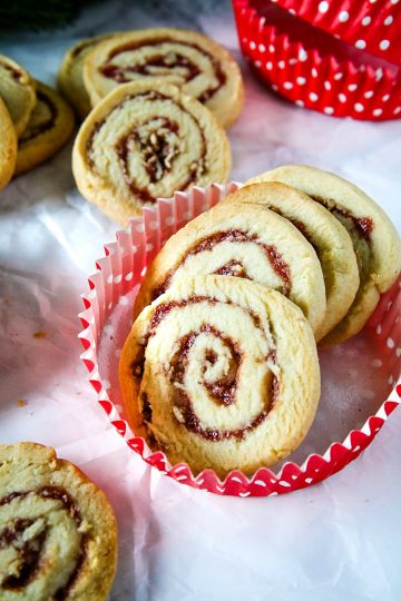 Raspberry Pecan Swirl Cookies are easy recipe sugar cookies swirled with raspberry jam and pecans. Perfect for holidays and gift giving!