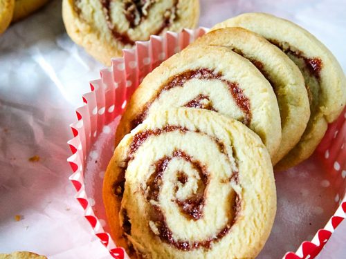 Raspberry Pecan Swirl Cookies are easy recipe sugar cookies swirled with raspberry jam and pecans. Perfect for holidays and gift giving!