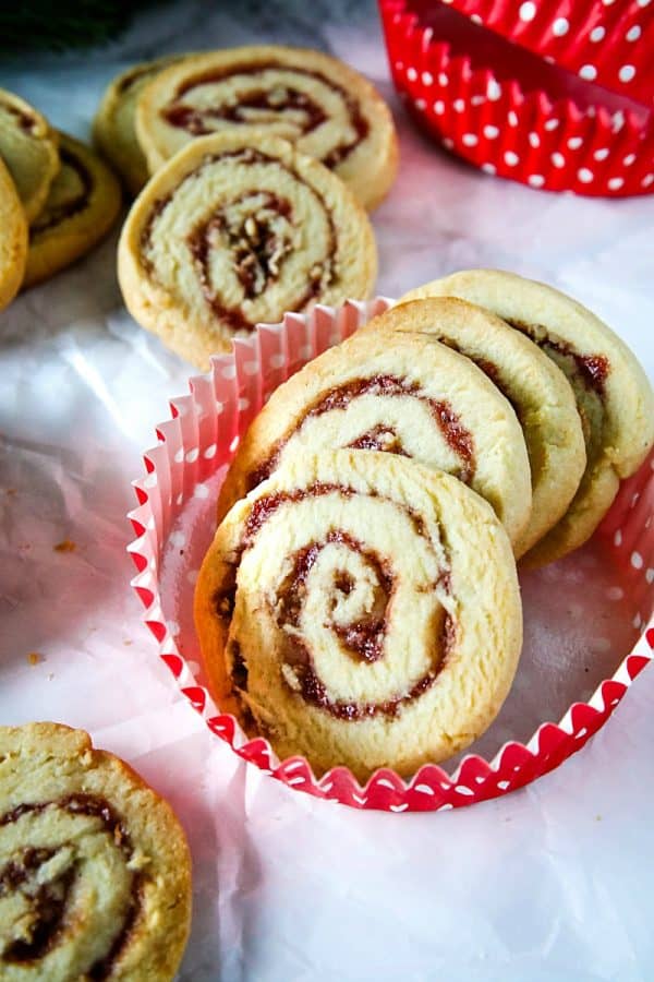 Raspberry Pecan Swirl Cookies are easy recipe sugar cookies swirled with raspberry jam and pecans. Perfect for holidays and  gift giving!