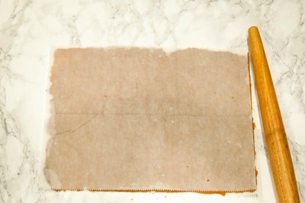 Roll out dough between two sheets of parchment