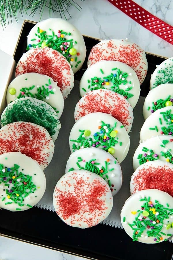 White Chocolate Gingerbread Crisps - thin gingerbread wafers, flavored with brown sugar, molasses and spices, covered with white chocolate and decorated with festive sprinkles. Merry and bright for the holidays!