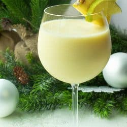 Pineapple Paradise Margarita is a smooth and delicious winter cocktail, guaranteed to evoke thoughts of sun and sand, made with pineapple tequila, coconut milk and frozen chunks of pineapple!