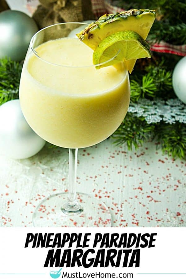 Pineapple Paradise Margarita is a smooth and delicious winter cocktail, guaranteed to evoke thoughts of sun and sand, made with pineapple tequila, coconut milk and frozen chunks of pineapple!