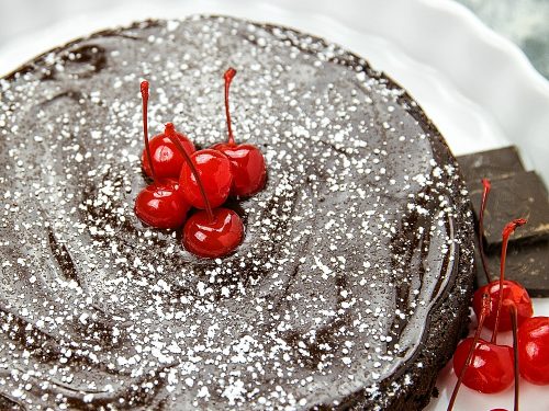 This decadent, gluten-free Flourless Chocolate Cake with Dried Cherries is for serious chocolate lovers. With only 8 ingredients, including bittersweet chocolate and cocoa powder, it's irresistibly delicious.#mustlovehomecooking