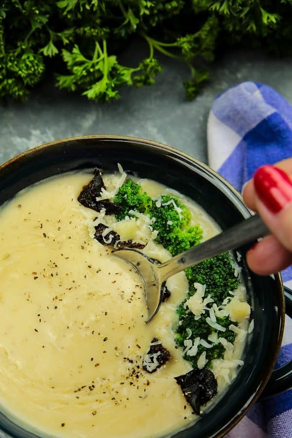 Slow Cooker Alfredo Potato Soup with hearty potatoes, tangy parmesan cheese and a hint of garlic is a cozy bowlful of comfort food ready to warm you on a cold winter night, made easy in the slow cooker.