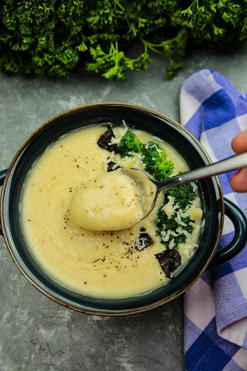 Slow Cooker Alfredo Potato Soup with hearty potatoes, tangy parmesan cheese and a hint of garlic is a cozy bowlful of comfort food ready to warm you on a cold winter night, made easy in the slow cooker.