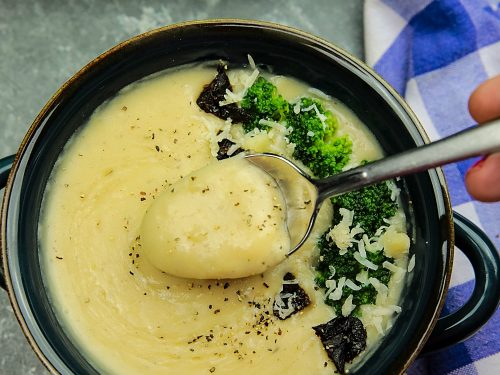 Slow Cooker Alfredo Potato Soup with hearty potatoes, tangy parmesan cheese and a hint of garlic is a cozy bowlful of comfort food ready to warm you on a cold winter night, made easy in the slow cooker.