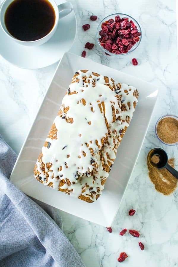 Cranberry Cinnamon Banana Bread - super moist and tender bread with cranberry, cinnamon and yogurt flavors make this delicious loaf perfect for breakfast or dessert!