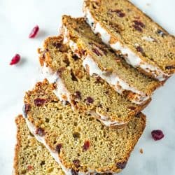 Cranberry Cinnamon Banana Bread - super moist and tender bread with cranberry, cinnamon and yogurt flavors make this delicious loaf perfect for breakfast or dessert! #mustlovehomecooking