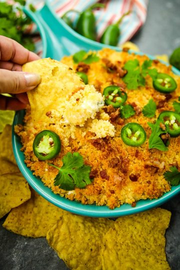 Jalapeno popper dip recipe is fresh, creamy, cheesy and completely addictive! Made with cream cheese, cheddar cheese and fresh jalapenos, then topped with toasted parmesan breadcrumbs. #mustlovehomecooking