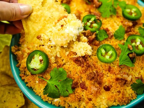 Jalapeno popper dip recipe is fresh, creamy, cheesy and completely addictive! Made with cream cheese, cheddar cheese and fresh jalapenos, then topped with toasted parmesan breadcrumbs. #mustlovehomecooking