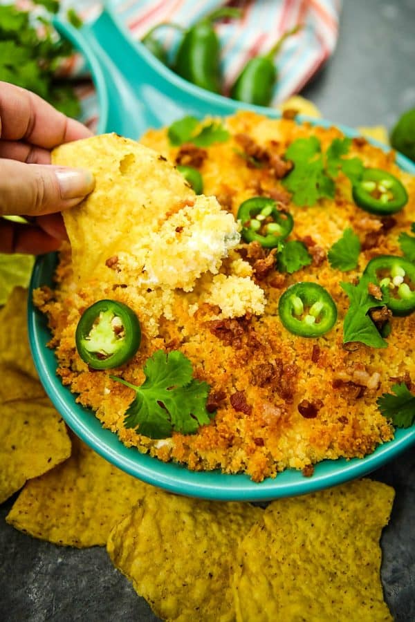 Jalapeno popper dip recipe is fresh, creamy, cheesy and completely addictive! Made with cream cheese, cheddar cheese and fresh jalapenos, then topped with toasted parmesan breadcrumbs. #mustlovehomecooking