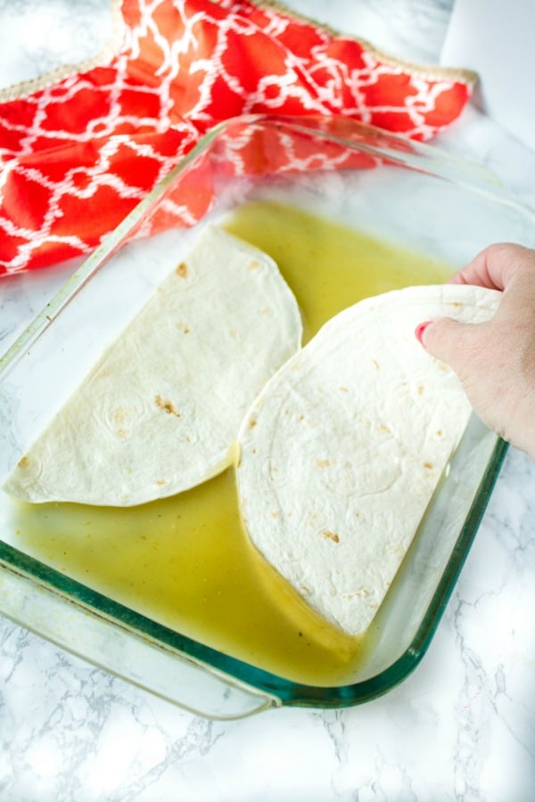 Chicken Taco Casserole is sauce coated tortillas, a zesty mix of chicken, beans, chilies and seasoning, topped with a thick layer of melted cheese. Boldly flavored and simple to make.#mustlovehomecooking #casserole #mexicanfood