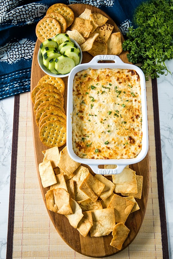 Easy Shrimp Scampi Dip is full of flavor and baked to creamy perfection. This crowd winner is simple to make with cooked shrimp in only 30 minutes. #mustlovehomecooking #shrimpdip #partyfood