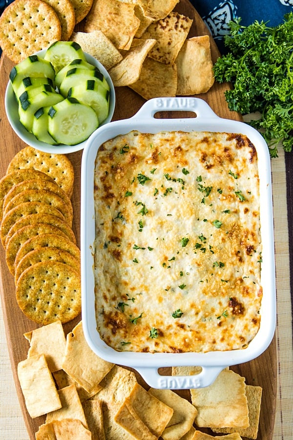 Easy Shrimp Scampi Dip is full of flavor and baked to creamy perfection. This crowd winner is simple to make with cooked shrimp in only 30 minutes. #mustlovehomecooking #shrimpdip #partyfood