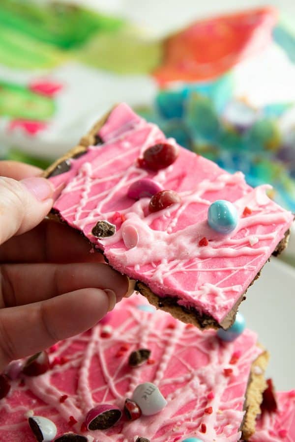 Sweetheart Graham Candy Bark made with layers of crispy graham crackers, chocolate, and candy pieces. It's the perfect sweet for your sweetheart. #mustlovehomecooking