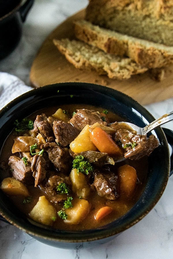 Easy Guinness Beef Stew is a hearty meal, with chunks of beef, potatoes and carrots that are slow simmered in a bottle of Guinness Stout. This makes a rich and cozy stew with a gravy that's irresistibly tasty. #mustlovehomecooking #guinnessbeefstew #stpatricksdayrecipes