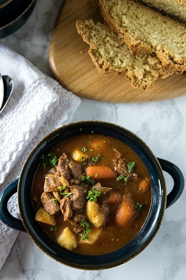 Easy Guinness Beef Stew is a hearty meal, with chunks of beef, potatoes and carrots that are slow simmered in a bottle of Guinness Stout. This makes a rich and cozy stew with a gravy that's irresistibly tasty. #mustlovehomecooking #guinnessbeefstew #stpatricksdayrecipes