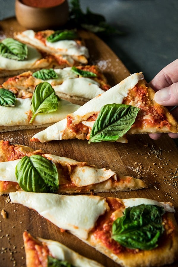 Easy Margherita Flatbread Pizza is a tasty, simple recipe for homemade pizza with flatbread crust, San Marzano pizza sauce, fresh mozarella and basil. #mustlovehomecooking #margheritapizza #pizzarecipes