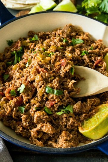 Easy Mexican Beef - tender shaved steak with diced tomatoes and green chilies, seasoned with taco seasoning. Ready to serve in 15 minutes and all in one pan! #mustlovehomecooking #mexican beef