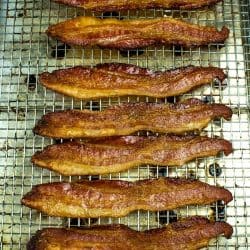 Crispy, smoked bacon cooked perfect every time right in the oven. Big batch bacon cooking with no flipping, no mess and no splatter. #mustlovehomecooking