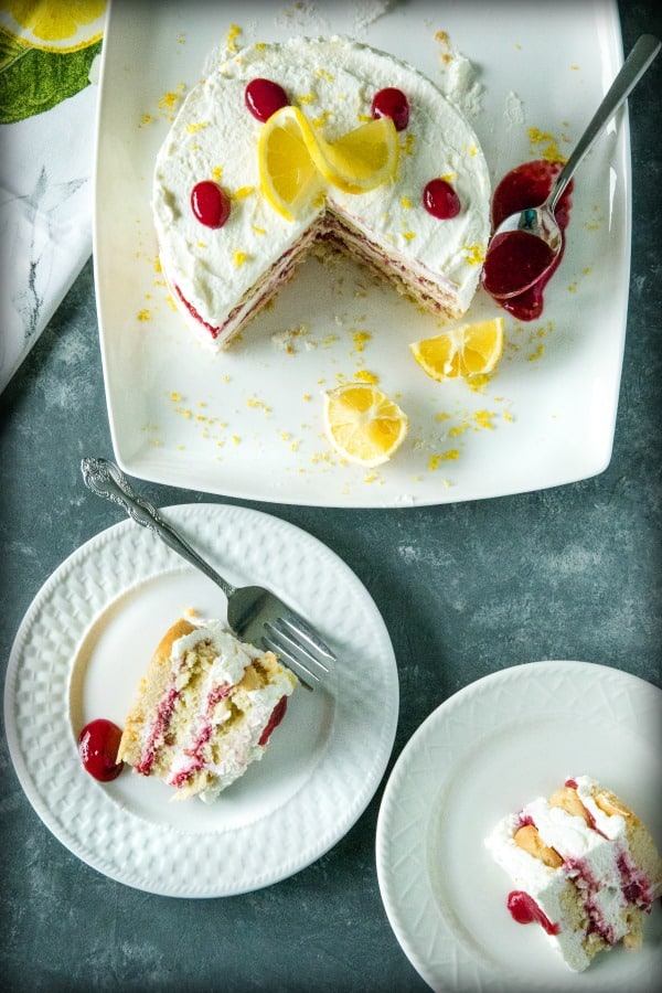 A sweet, fluffy indulgence, this Raspberry lemon Icebox Cake is simple to prep in minutes with whipped cream, raspberries and buttery shortbread cookies.#mustlovehomecooking