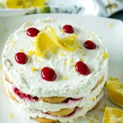 A sweet, fluffy indulgence, this Raspberry lemon Icebox Cake is simple to prep in minutes with whipped cream, raspberries and buttery shortbread cookies. #mustlovehomecooking