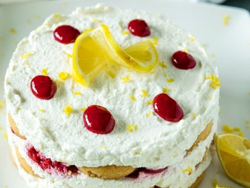A sweet, fluffy indulgence, this Raspberry lemon Icebox Cake is simple to prep in minutes with whipped cream, raspberries and buttery shortbread cookies. #mustlovehomecooking