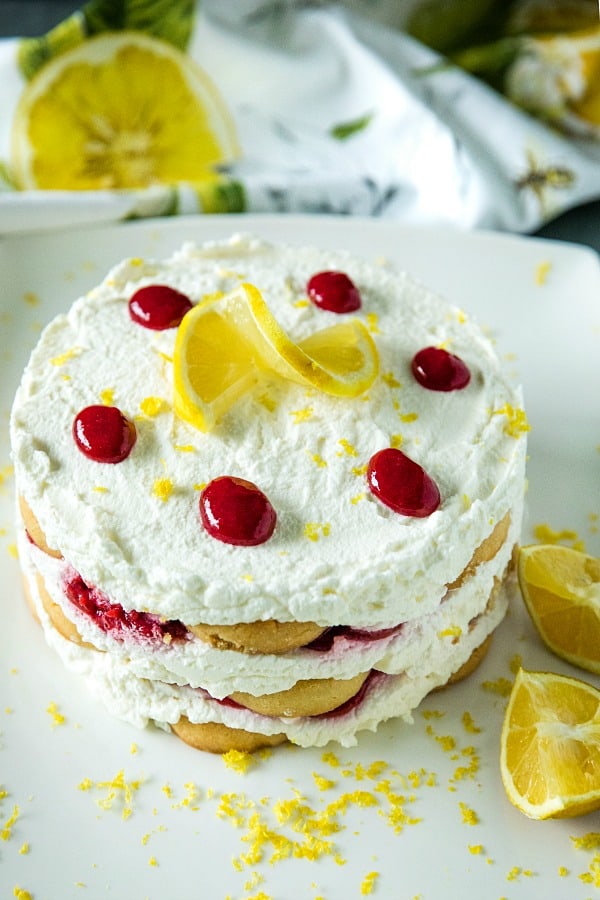 A sweet, fluffy indulgence, this Raspberry lemon Icebox Cake is simple to prep in minutes with whipped cream, raspberries and buttery shortbread cookies. #mustlovehomecooking