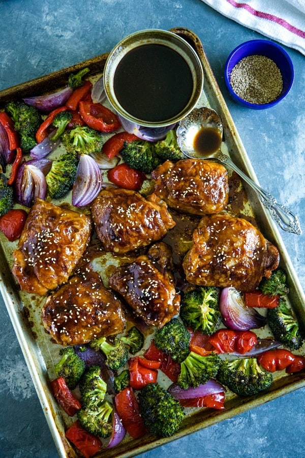Sheet Pan Sesame Chicken with broccoli, peppers and an addictive tangy sauce. A crave worthy alternative to take-out!#mustlovehome