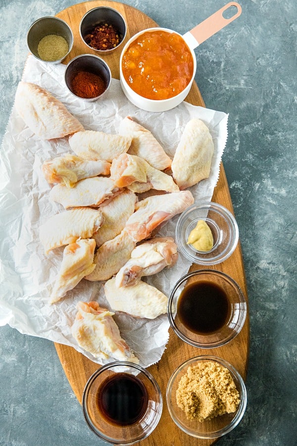 Baked spicy apricot chicken wings brushed with a spicy glaze of apricot preserves, brown sugar and zesty seasonings. #mustlovehomecooking #chickenwingrecipes