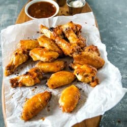 Baked spicy apricot chicken wings brushed with a spicy glaze of apricot preserves, brown sugar and zesty seasonings. #mustlovehomecooking #chickenwingrecipes