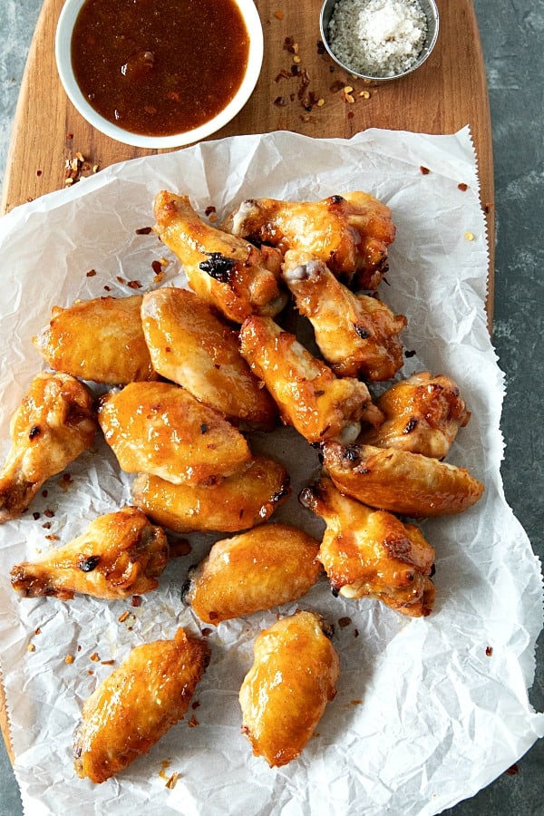 Baked spicy apricot chicken wings brushed with a spicy glaze of apricot preserves, brown sugar and zesty seasonings. #mustlovehomecooking #chickenwingrecipes