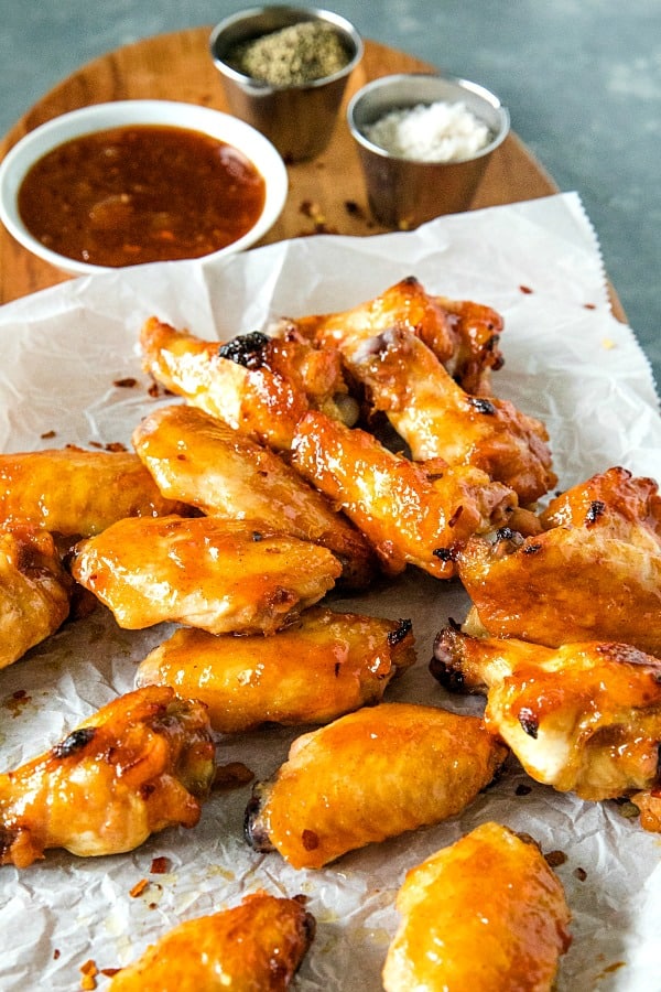 Baked spicy apricot chicken wings brushed with a spicy glaze of apricot preserves, brown sugar and zesty seasonings. #mustlovehomecooking #chickenwingrecipes