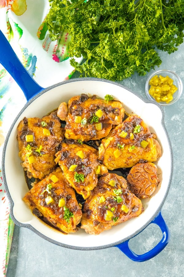 Moist, savory chicken smothered in green chilies and a tantalizingly zesty sauce made with vinegar, soy sauce, brown sugar and spices. #mustlovehomecooking