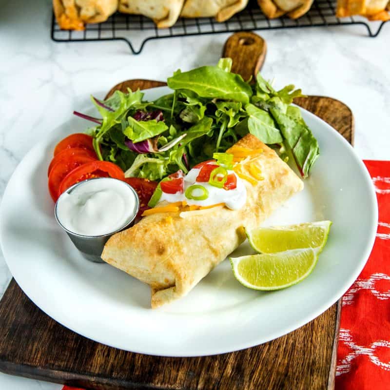 Easy Oven Chicken Chimichangas with seasoned rice, salsa and cheese are a healthy, lighter twist on the Mexican classic. #mustlovehomecooking