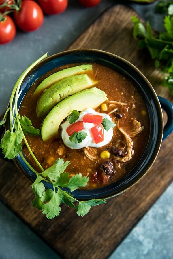 Instant Pot Mexican Chicken Soup with black beans, tomatoes, green chilies and chipotle peppers is a deliciously zesty and comforting meal made quick and easy in your pressure cooker. #mustlovehomecooking