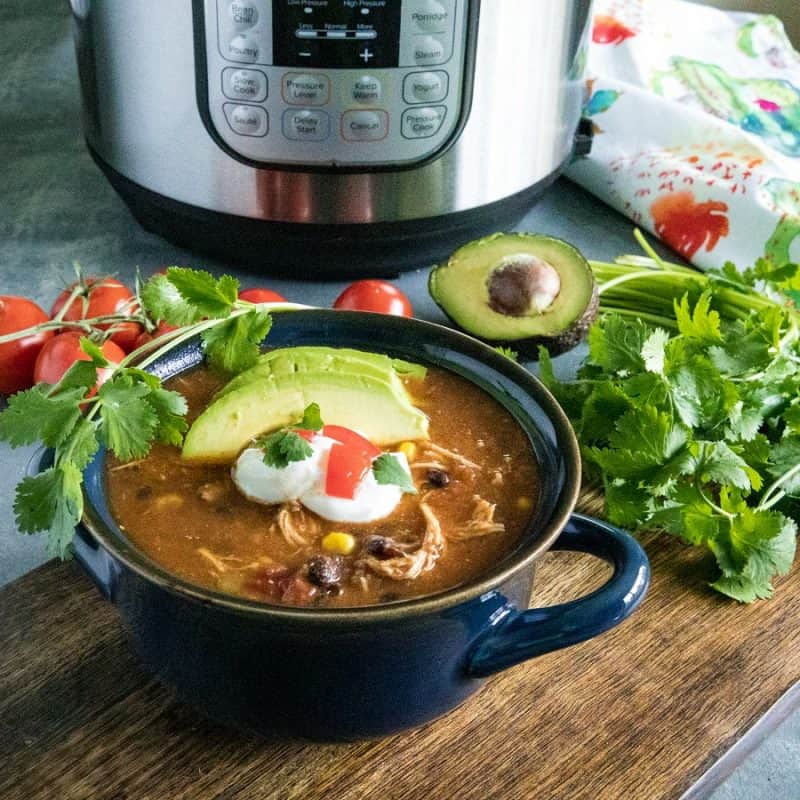 Instant Pot Mexican Chicken Soup with black beans, tomatoes, green chilies and chipotle peppers is a deliciously zesty and comforting meal made quick and easy in your pressure cooker. #mustlovehomecooking