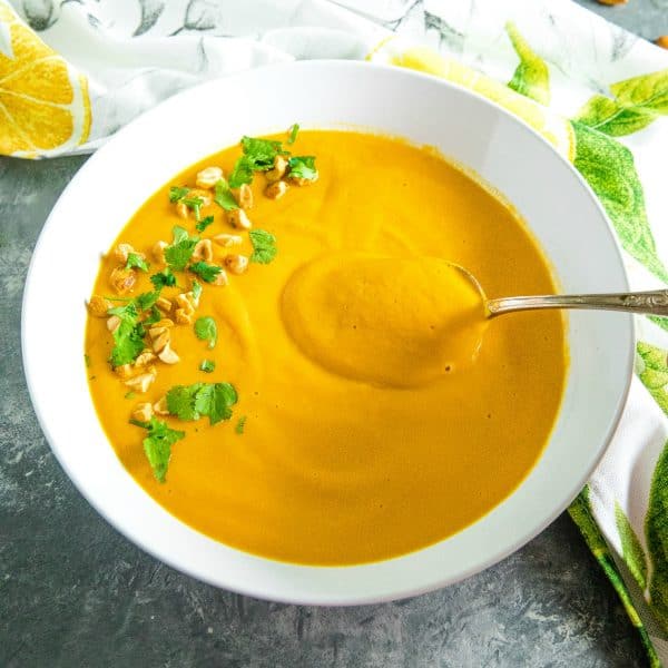 Silky smooth Instant Pot Thai Carrot Soup, with peanut butter, coconut milk and vegetable stock is light, spicy and naturally a little bit sweet. #mustlovehomecooking