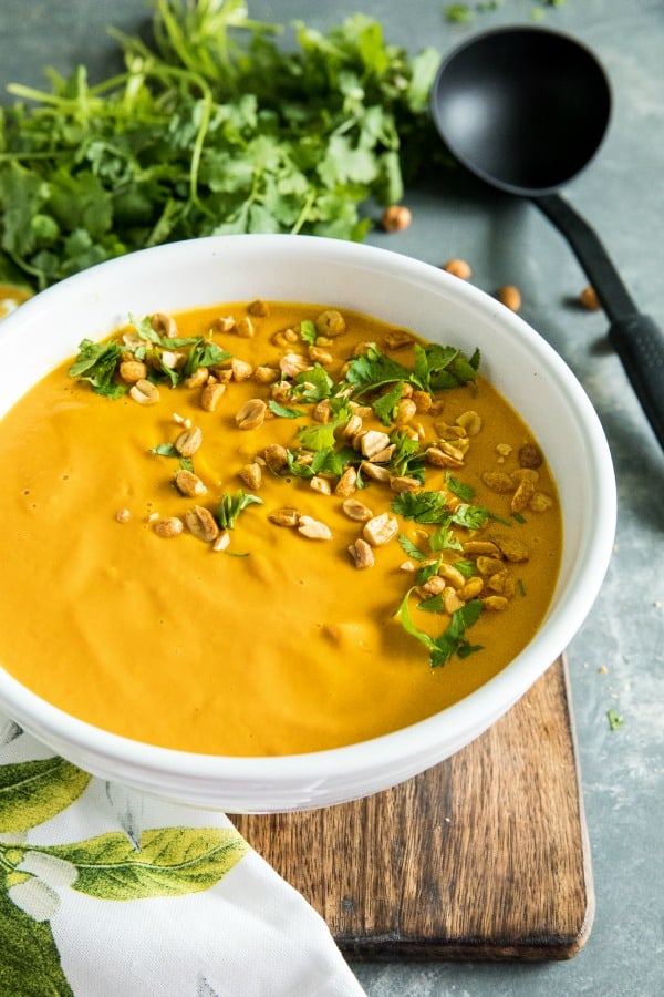 Silky smooth Instant Pot Thai Carrot Soup, with peanut butter, coconut milk and vegetable stock is light, spicy and naturally a little bit sweet. #mustlovehomecooking