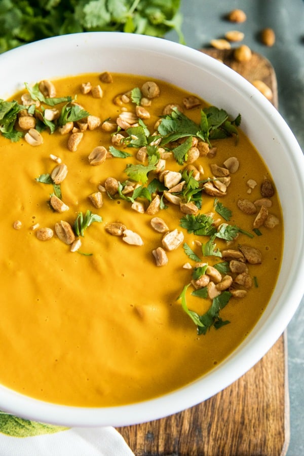 Silky smooth Instant Pot Thai Carrot Soup, with peanut butter, coconut milk and vegetable stock is light, spicy and naturally a little bit sweet. #mustlovehomecooking